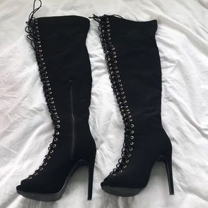 Thigh-high lace up heels